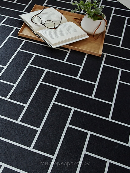 Круглый черный ковер с геометрическим рисунком Bellatrix