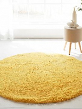 Желтый круглый длинноворсный ковер Softy